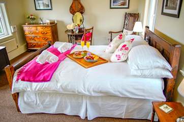 The master has uninterrupted views across the fields and out to the coast. The furniture gives the room a wonderful look of grandeur and of an era passed. This room also benefits from a vanity sink.