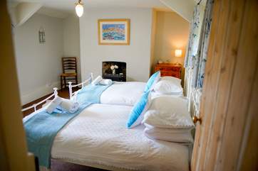 The first bedroom on your right as you come up the stairs
is the twin room with three-foot beds, offering a lovely appointed room with views out across the fields.