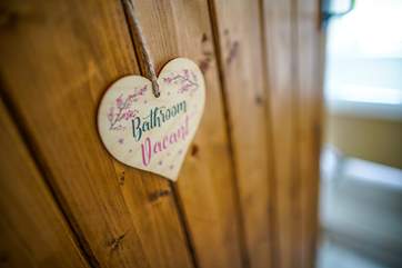 The main bathroom offers a roll-top bath, separate shower cubicle, wash-basin and WC.