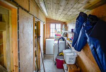 The outhouse situated to the side of the kitchen houses the tumble-drier and additional equipment and supplies for your personal use whilst at the cottage. 
