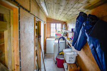 The outhouse situated to the side of the kitchen houses the tumble-drier and additional equipment and supplies for your personal use whilst at the cottage.