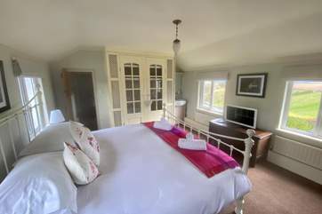 The master bedroom benefits from dual-aspect windows allowing the room to bathe in light, but most importantly make breakfast with a view one to remember.