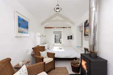 The bed is at the far end of the room, it is against the wall, so access is limited.