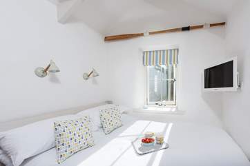 The super comfy bed has lovely linen, and the TV is positioned so that you can lie back and enjoy whilst in bed.