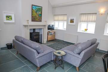The living area benefits from a Smart TV and wood-burner with the original slate floor.