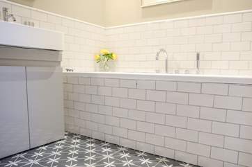 The main bathroom sits off the hall offering a bath, WC a wash-basin and under-floor heating.