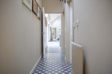 The view from bedroom 1 looking down the length of the cottage through to the entrance hall.