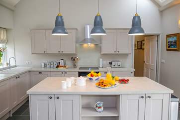 The kitchen sits at the opposite end of the living area.