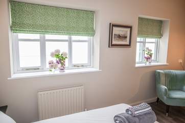 Bedroom 3 sits to the end of the cottage and offers the perfect spot to sit and read a book.