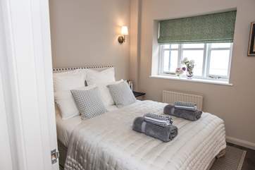 Bedroom 3 offers a tranquil room furnished beautifully.