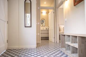 The hall benefits from under-floor heating with plenty of storage for shoes and coats. From here you can access bedroom 3 and the shower-room.