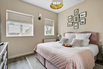 The inviting bedrooms are beautifully furnished.