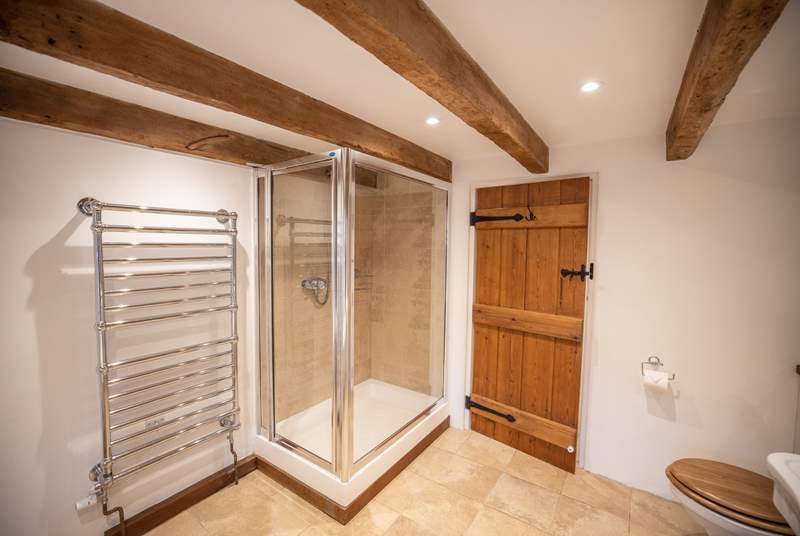 The shower cubicle is oversized for maximum space and luxury. Please note you have to step up and out of the shower.