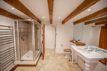 The main bathroom sits between both of the bedrooms on the ground level.