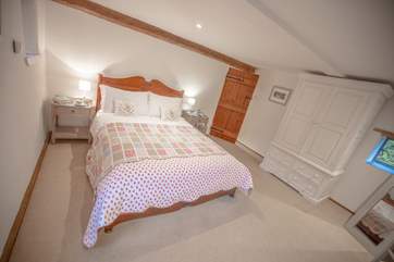 The main bedroom also benefits from a TV.