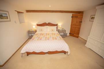 The main bedroom also benefits from a TV.