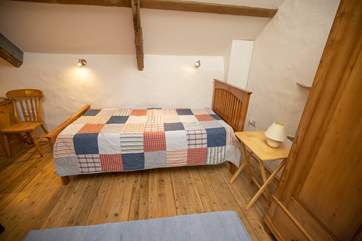 The mezzanine area has a single bed. Owing to it being a bed on the open mezzanine level this room would suit a teenager.