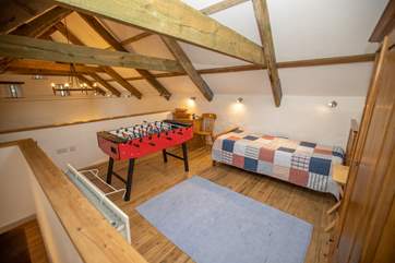 The mezzanine area is not enclosed so the laughter can be heard throughout the barn as the competition around the table-football heats up.