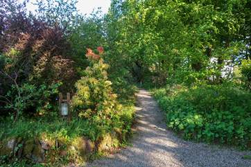 The path up to the barn from your own private entrance and parking area. Your area is clearly marked for your enjoyment. Please note that there are steps up from the parking area and the ground is uneven.