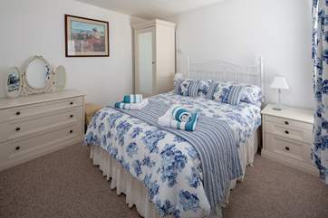 Super comfy and inviting bedroom.