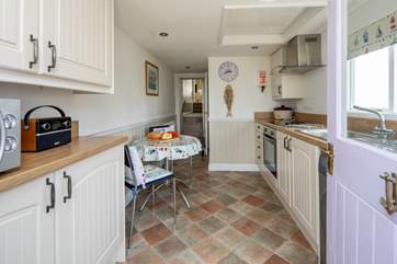 The kitchen leads up into the living and sleeping area.