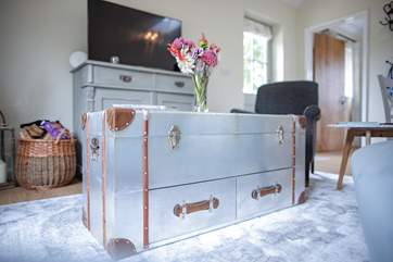 The chest coffee table is a lovely feature for a room that has been designed for relaxing and enjoy a film on the Smart TV.