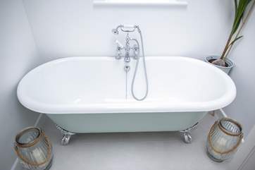 The roll-top bath offers luxury.