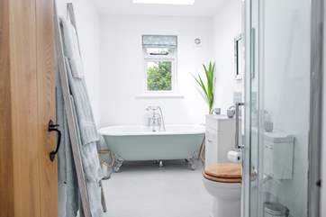 A bathroom with a view offering the perfect chill out zone with the benefit of under-floor heating.