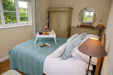 The king-size bed benefits from a 3000 sprung mattress with beautiful furniture to complement the room.