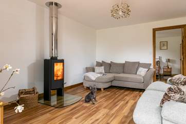 Snuggle up on the sofa in front of the wood-burner.