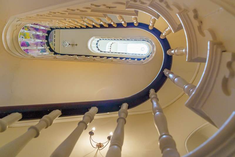 Climb the majestic sweeping stairway.