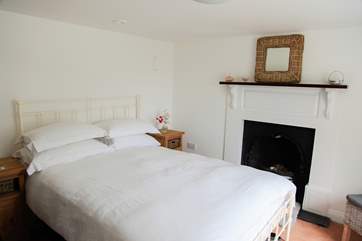 Bedroom 1 is located on the ground floor and has a lovely view of the garden and the sea.