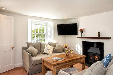 The cosy sitting-room with its toasty wood-burner makes this a perfect retreat all year round.