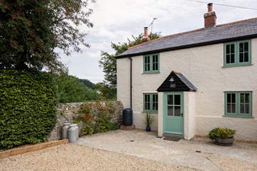 Poacher's Cottage is on the far left of a row of four terraced cottages.