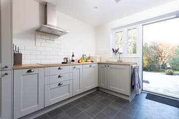 The kitchen is excellently equipped and has a door out to your private patio.