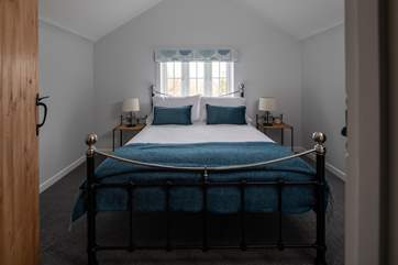 A sumptuous king-size bed in the main bedroom.