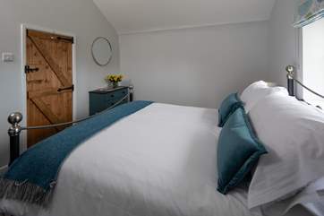 The gorgeous main bedroom is a delight.