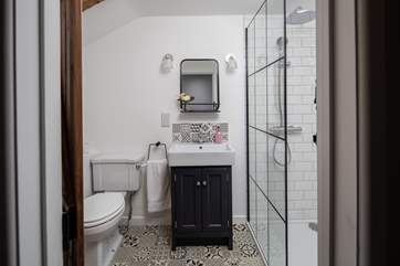 Luxurious shower-room with drench-head fitting.