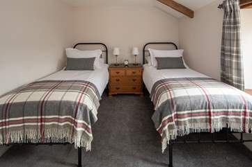This stylish twin room looks out over the front of the cottage.