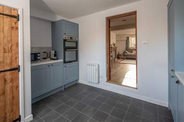 Peeking through to the sitting-room from the kitchen (please mind the step).