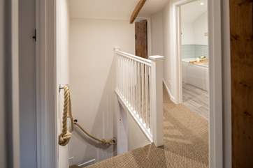 The characterful staircase is a traditional Dorset winder which is quite steep and narrow but there is a rope handrail all the way up.