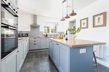 The gorgeous kitchen has a leads out to your private patio.