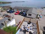 Looking down from the balcony to the front terrace.
