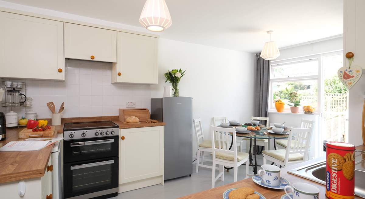 The sociable kitchen has stairs that lead out to the rear garden.