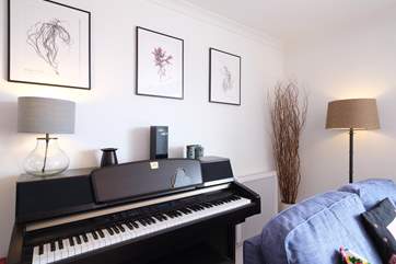 Play a tune on the piano.