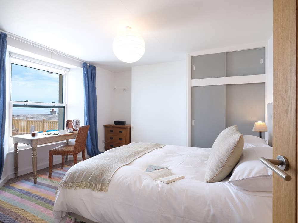 Bedroom 1 has wonderful views of Gerrans Bay.