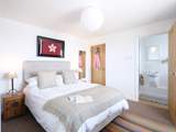 The main bedroom has an en suite shower-room.