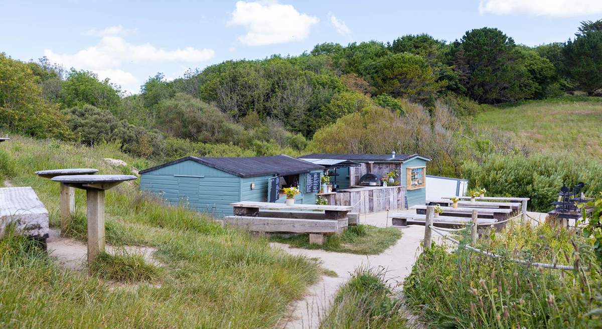 Enjoy a spot of lunch at The Hidden Hut beach cafe.