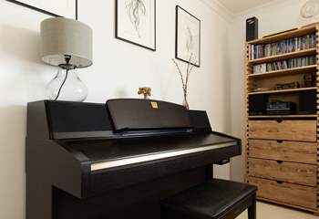 Play a tune on the piano.