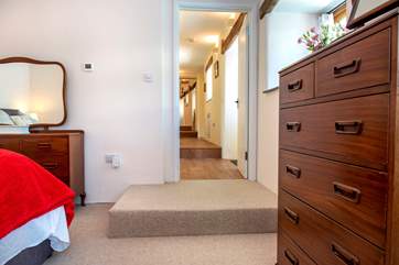 From bedroom 2 there is a step up to the corridor.